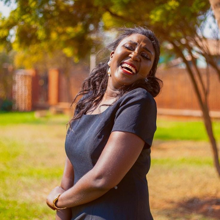 Avery Singh, Lead Design Curator at Adaptive Know Ledgehub, reviewing corporate floral arrangements